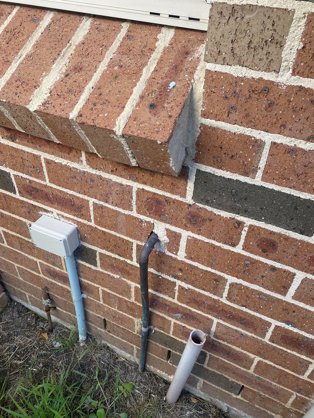 Unsealed pipe penetrations giving pests a way into the wall, found during a building and pest inspection in Horningsea Park