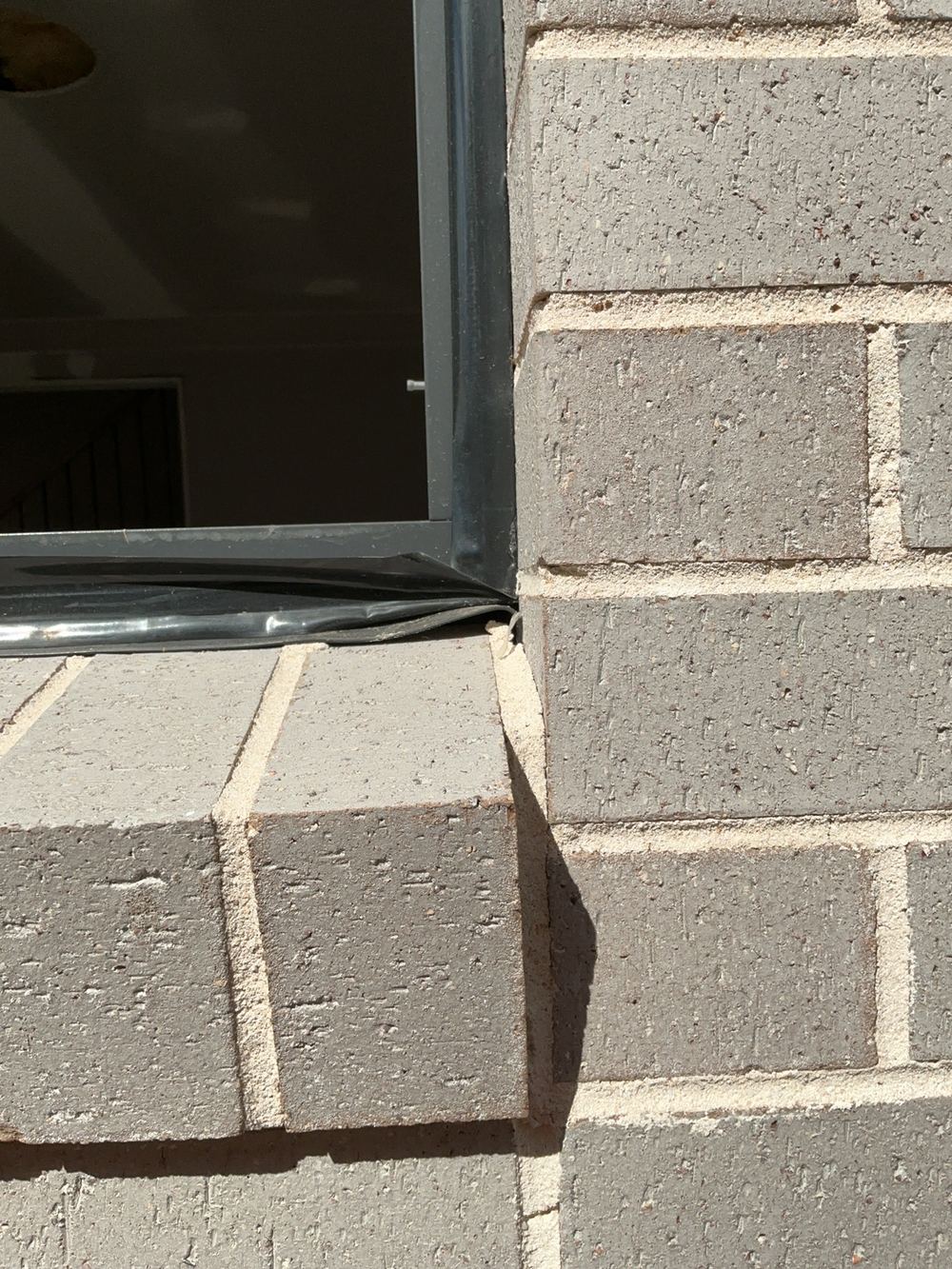 Window rubber flashing needing adjustment, Cobbitty